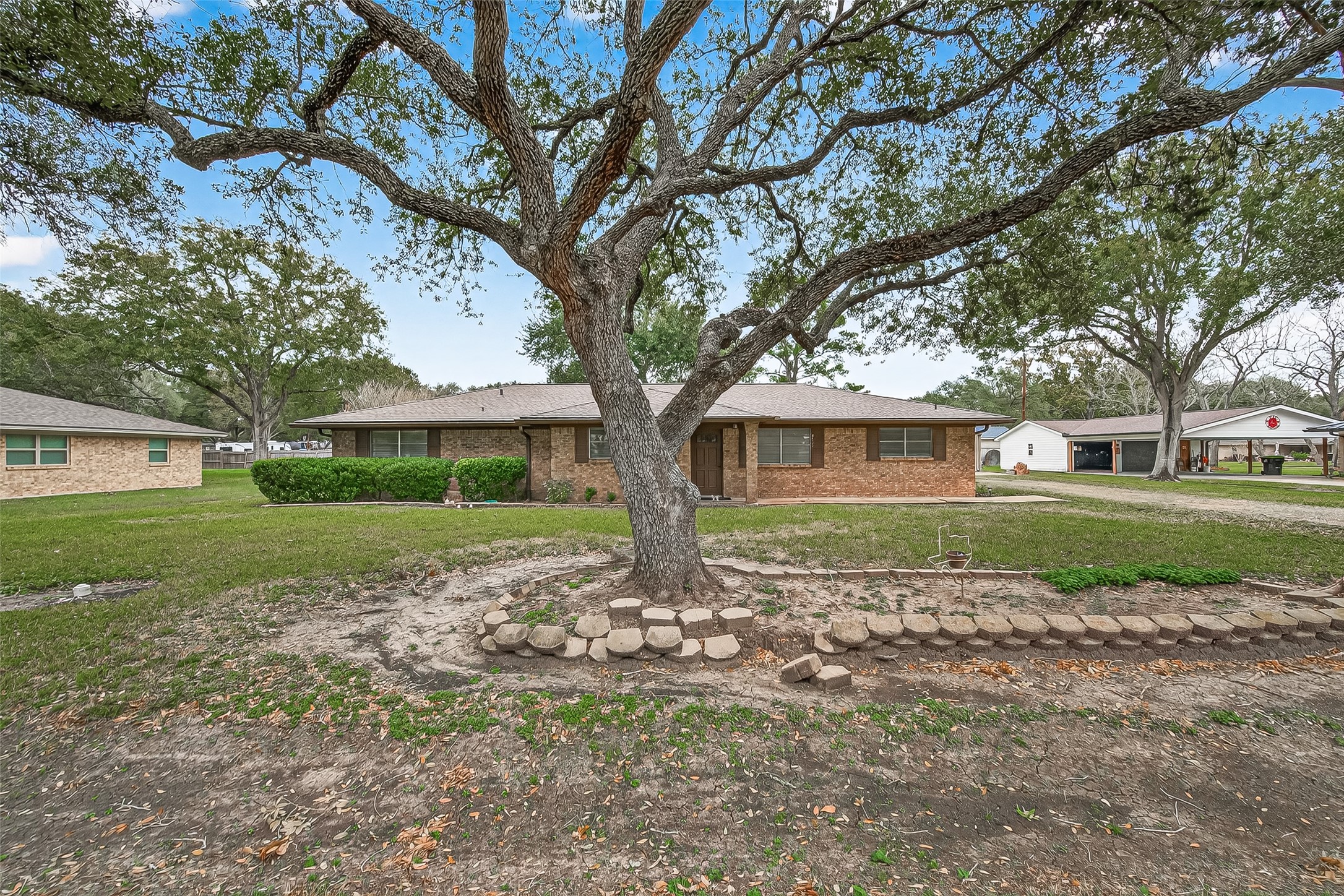 9525 Gene Street Needville, TX 77461 - Photo 4 of 48 a front view of a house with garden