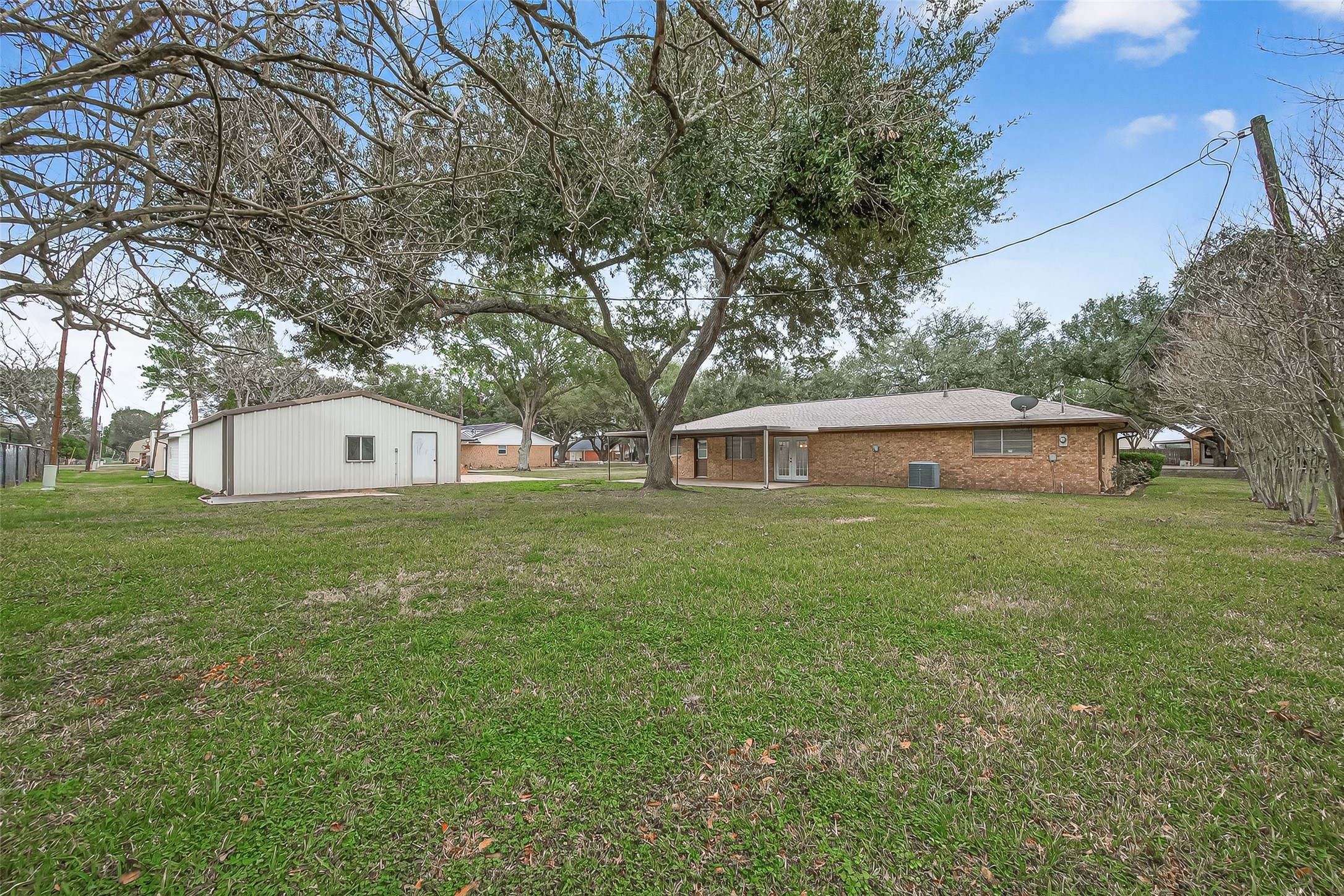 9525 Gene Street Needville, TX 77461 - Photo 44 of 48 a front view of a house with a garden