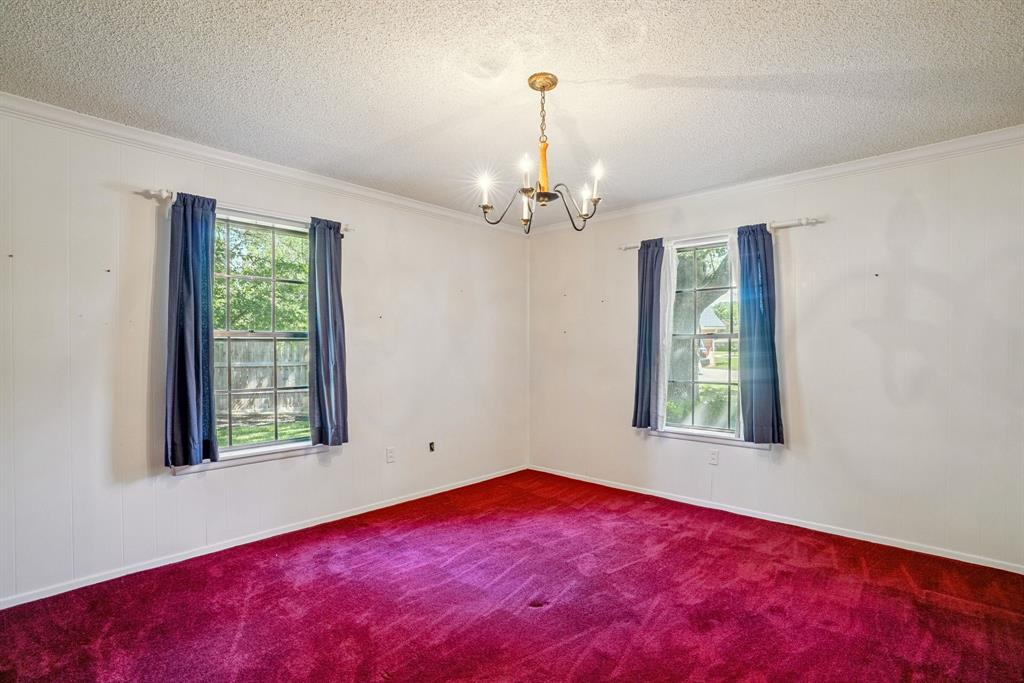 2617 Park Street Commerce, TX 75428 - Photo 17 of 34 wooden floor in an empty room with a window