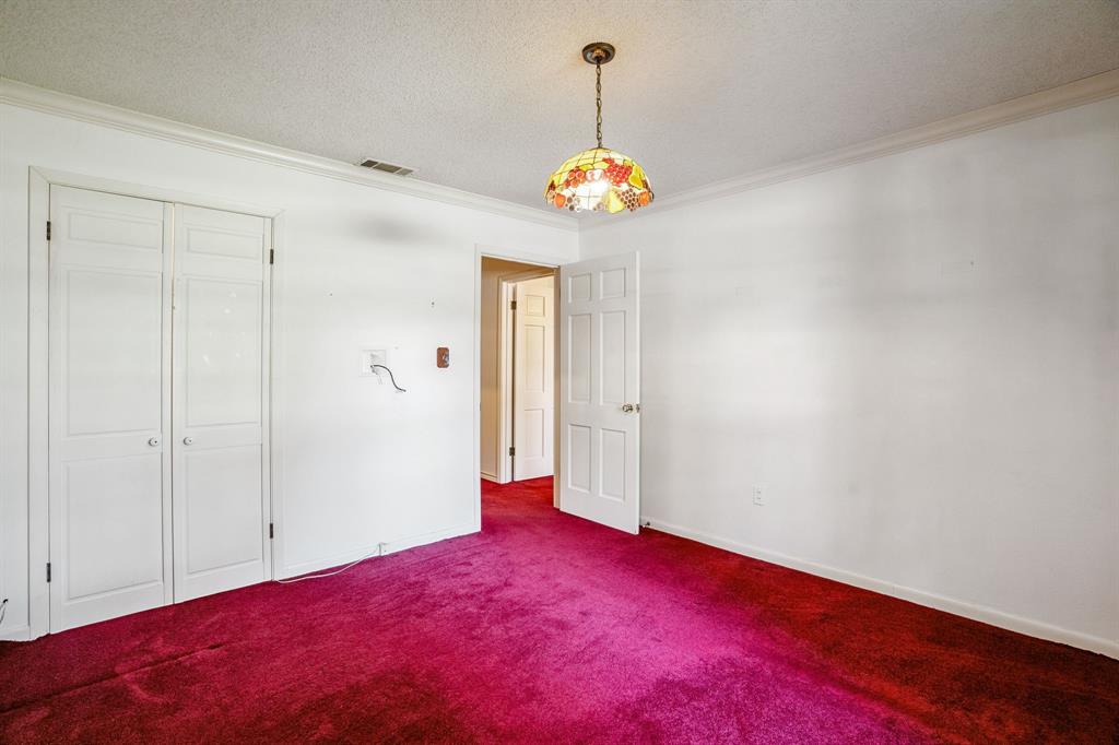 2617 Park Street Commerce, TX 75428 - Photo 20 of 34 a view of an empty room with a chandelier fan