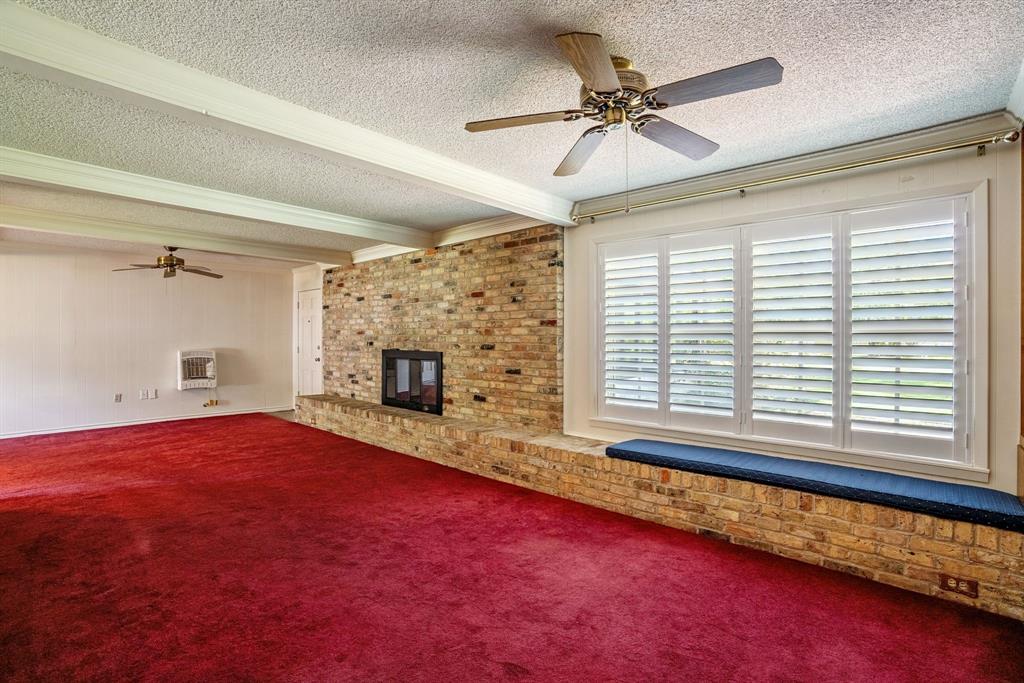 2617 Park Street Commerce, TX 75428 - Photo 5 of 34 a view of an empty room with a window and fireplace