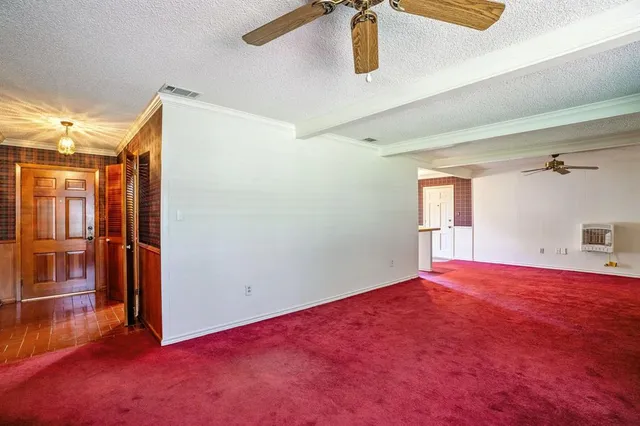 a view of empty room with windows