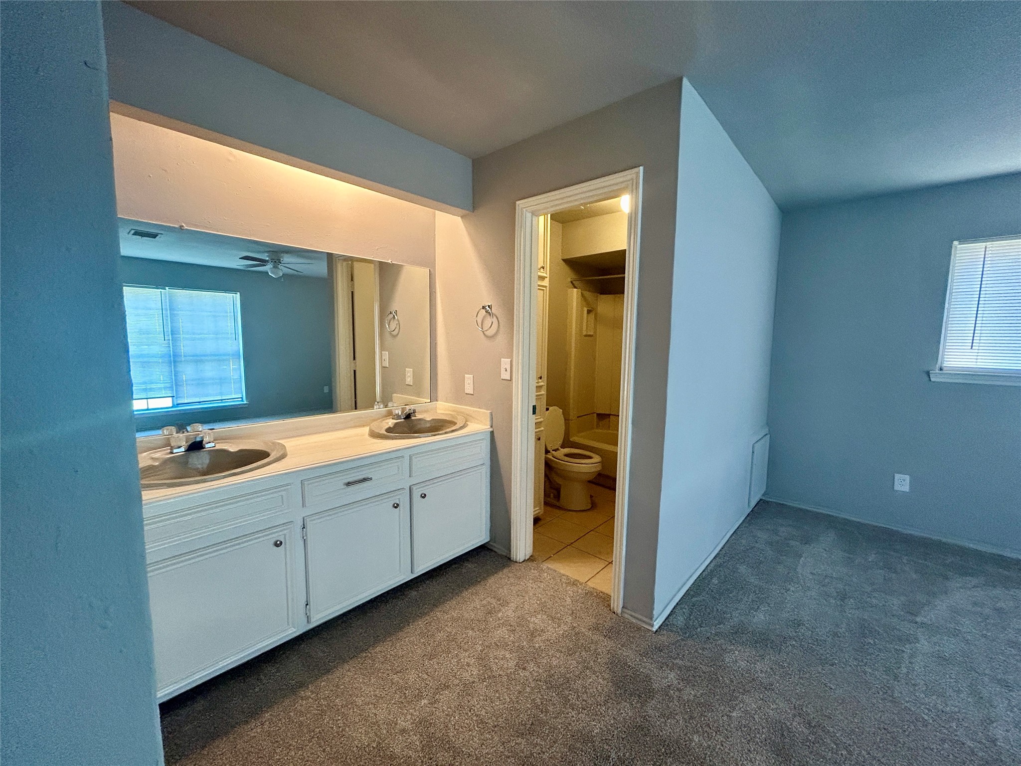 2510 Knollbrook Lane Spring, TX 77373 - Photo 21 of 24 a view of a bathroom with double vanity sink and a mirror