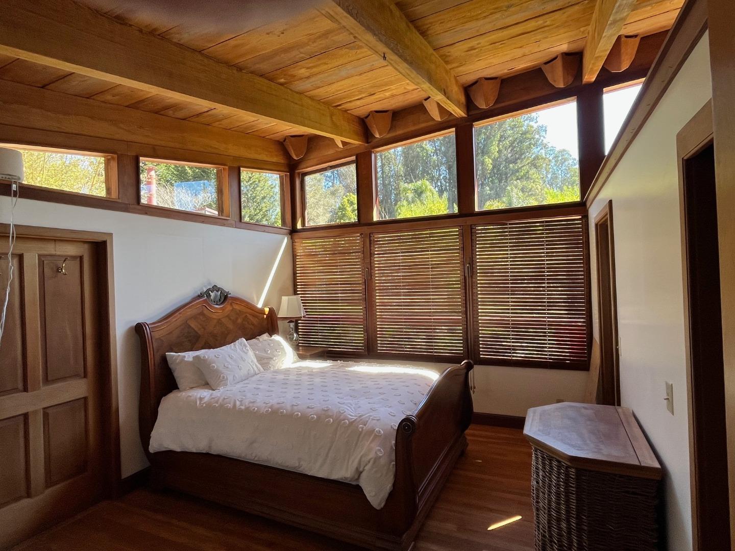1557 Day Valley Road Aptos, CA 95003 - Photo 13 of 43 a bedroom with a bed next to a window