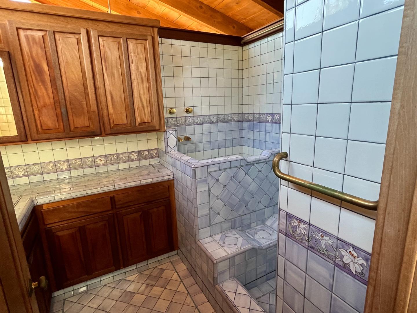 1557 Day Valley Road Aptos, CA 95003 - Photo 14 of 43 a bathroom with a granite countertop sink a toilet and bathtub