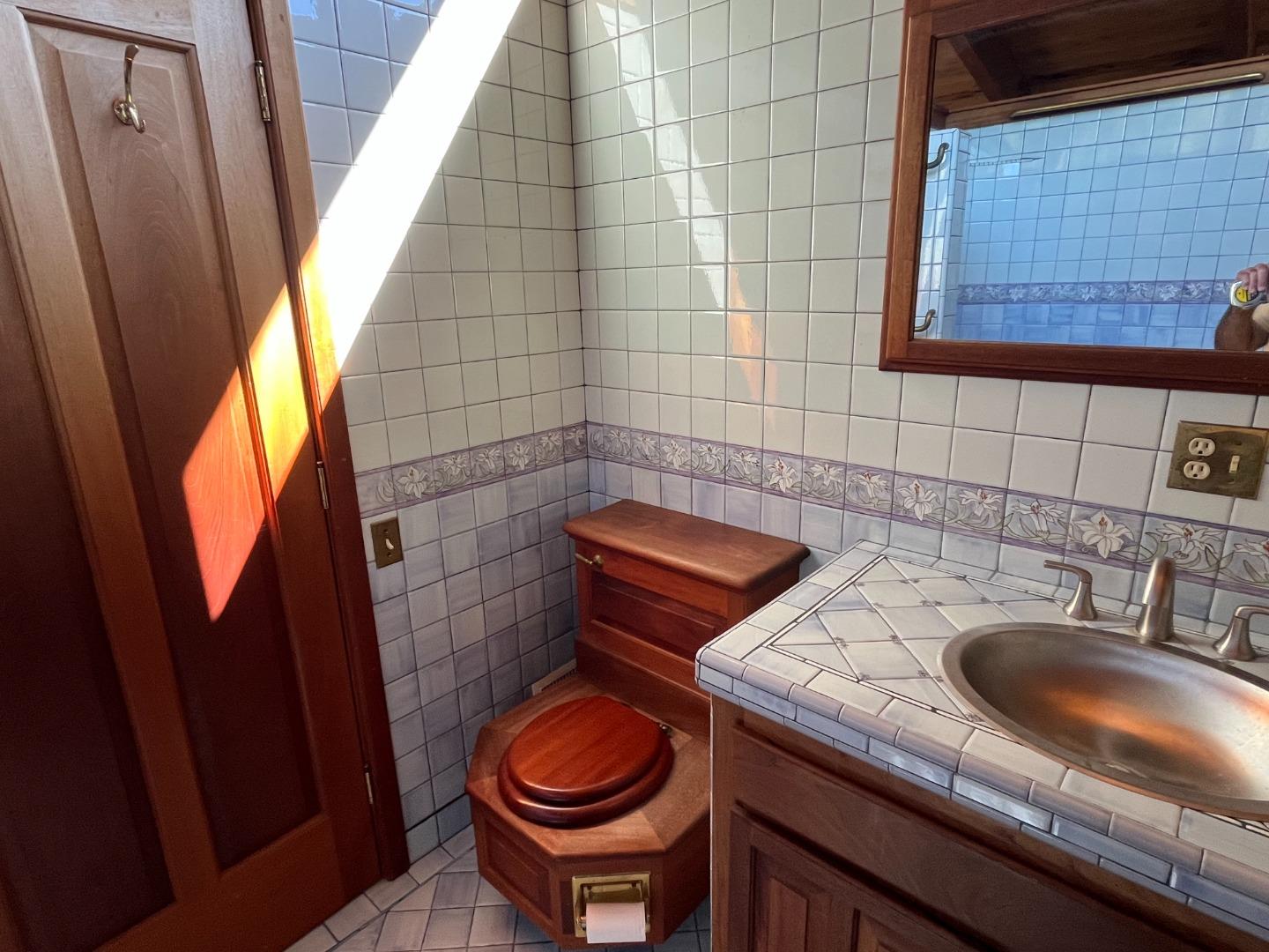 1557 Day Valley Road Aptos, CA 95003 - Photo 15 of 43 a bathroom with a sink a toilet and shower