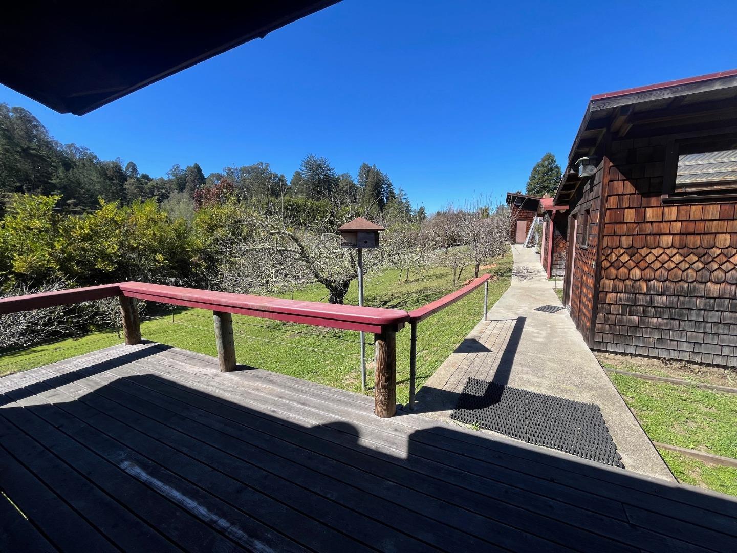 1557 Day Valley Road Aptos, CA 95003 - Photo 2 of 43 a view of a deck with a table and chairs