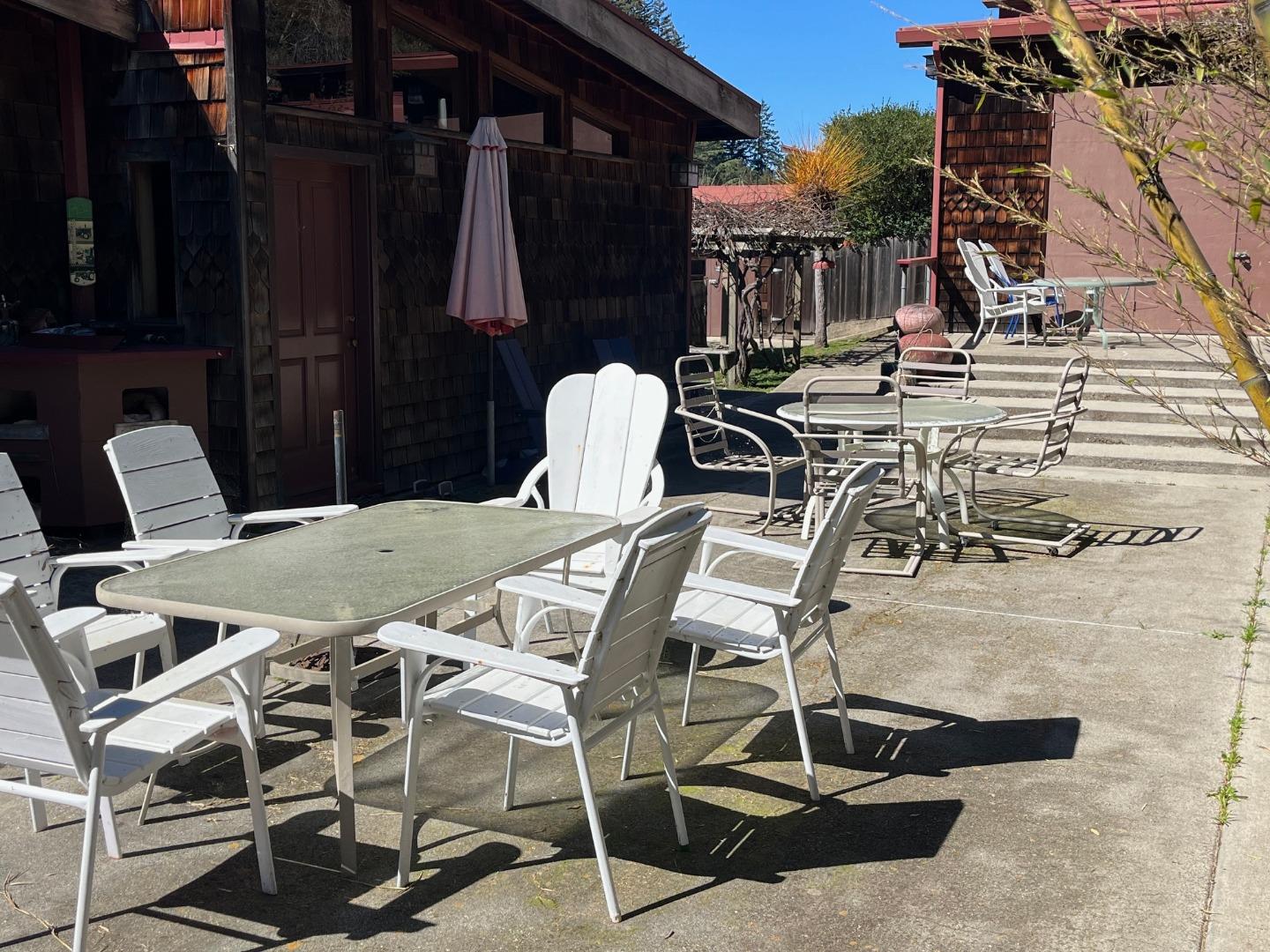 1557 Day Valley Road Aptos, CA 95003 - Photo 22 of 43 a view of a dinning tables and chairs in patio