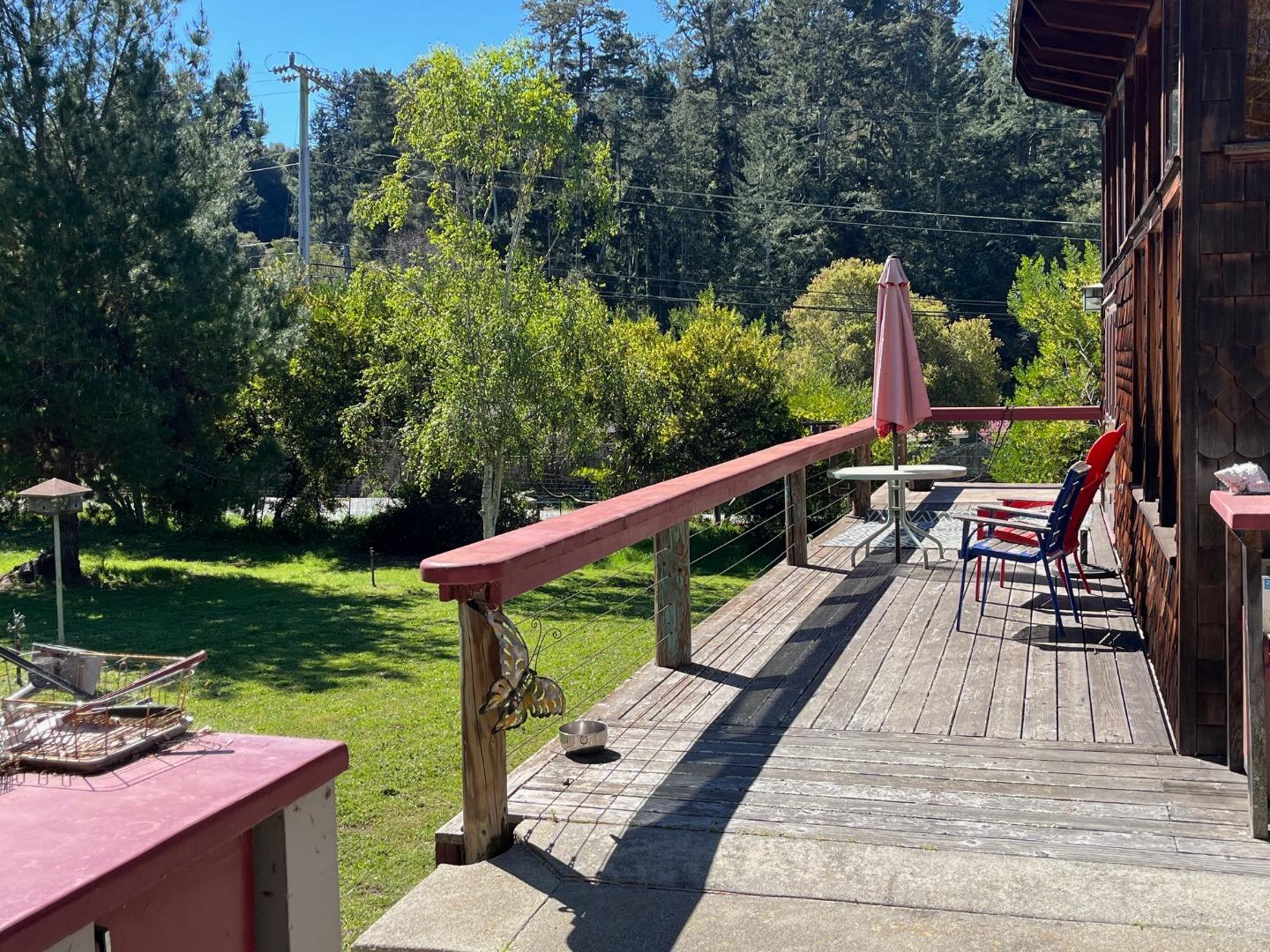 1557 Day Valley Road Aptos, CA 95003 - Photo 23 of 43 a view of a patio with a table chairs and a backyard