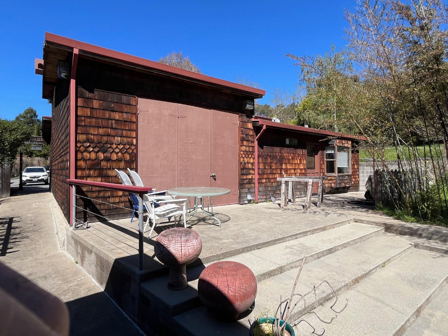 1557 Day Valley Road Aptos, CA 95003 - Photo 31 of 43 a backyard of a house with barbeque oven table and chairs