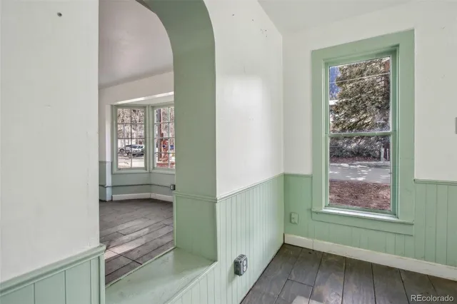 a view of a dining room with furniture and a window