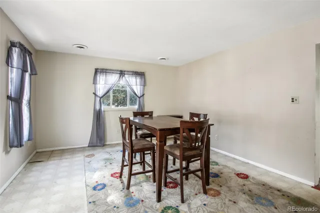 a kitchen with a stove a refrigerator and a sink
