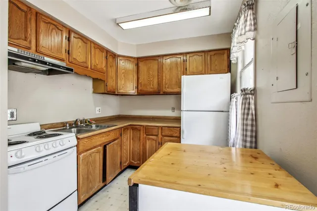 a bedroom with a bed and a night stand