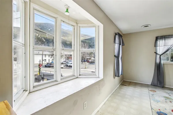 a bathroom with a sink a toilet and shower curtain