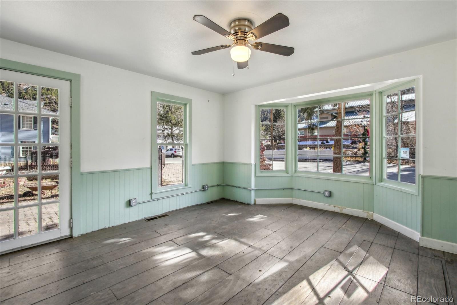 710 Sixth Street Georgetown, CO 80444 - Photo 10 of 25 a view of an empty room with window and wooden floor