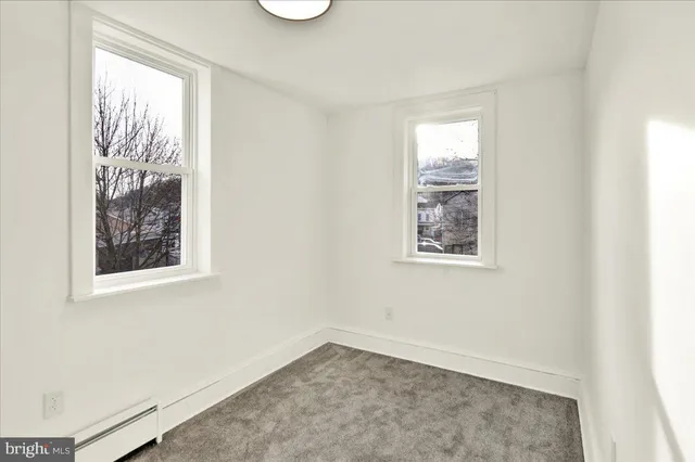 an empty room with windows