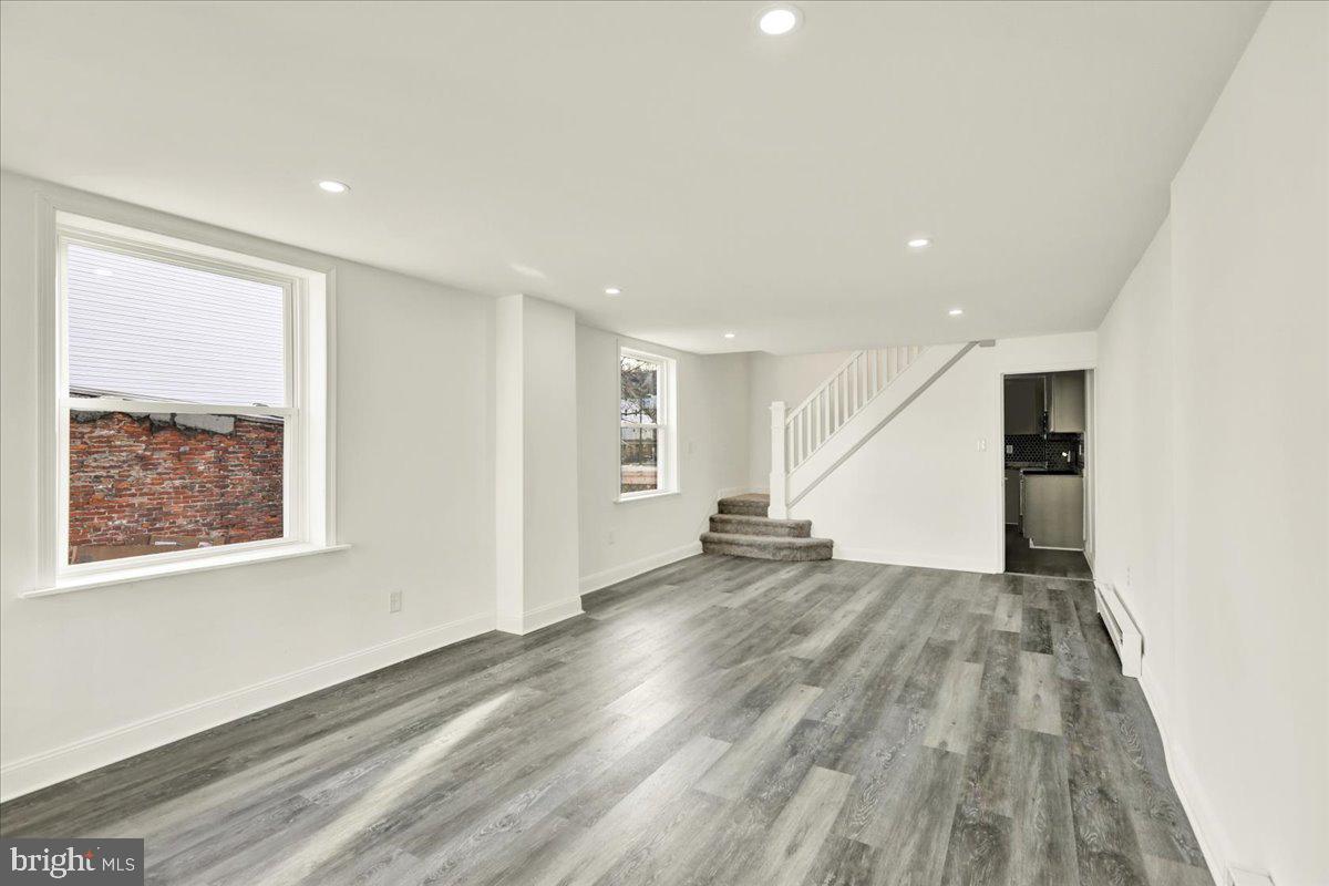 32 South Front Street St. Clair, PA 17970 - Photo 8 of 30 an empty room with wooden floor and windows