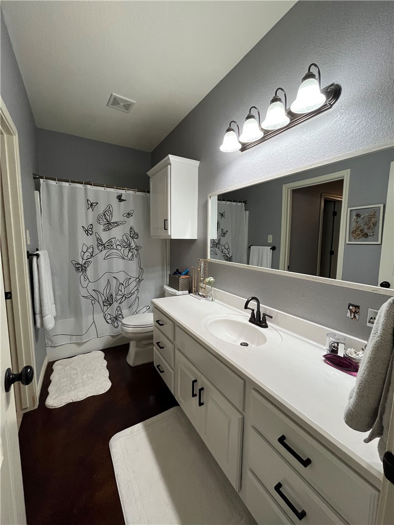 3203 Corporal Road College Station, TX 77845 - Photo 21 of 29 a bathroom with double vanity sink and a mirror