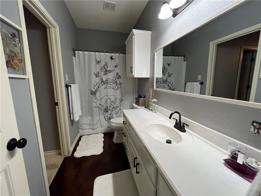 3203 Corporal Road College Station, TX 77845 - Photo 23 of 29 a bathroom with a sink toilet and shower
