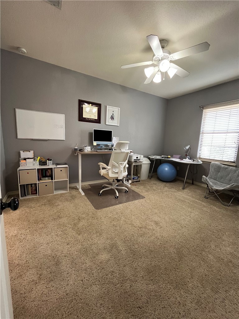 3203 Corporal Road College Station, TX 77845 - Photo 24 of 29 a view of a livingroom with furniture and a ceiling fan