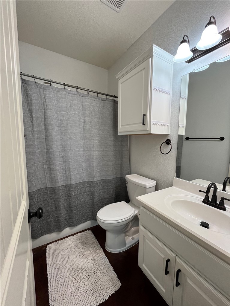 3203 Corporal Road College Station, TX 77845 - Photo 26 of 29 a bathroom with a sink toilet and shower