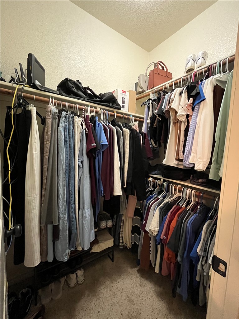 3203 Corporal Road College Station, TX 77845 - Photo 27 of 29 a view of walk in closet with clothes and shoes