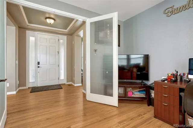 a bathroom with a granite countertop sink and a mirror a bathtub