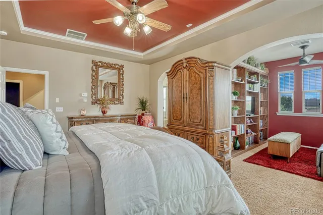 a living room with furniture a window and a flat screen tv