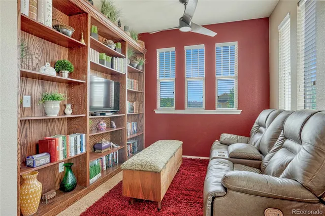 a bathroom with a granite countertop sink a large mirror and a bathtub
