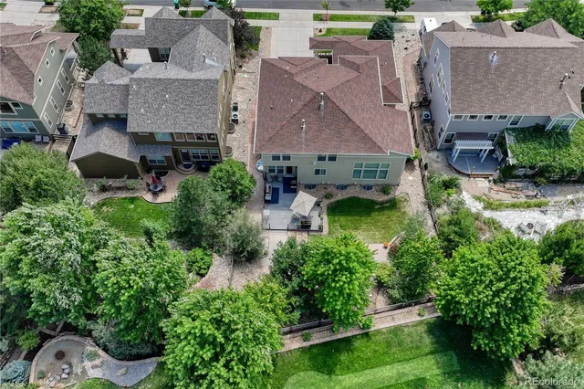 an aerial view of residential houses and lake view