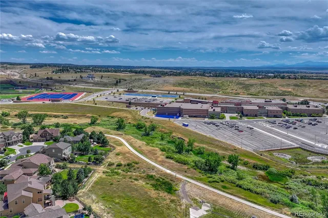 an aerial view of a house with a garden