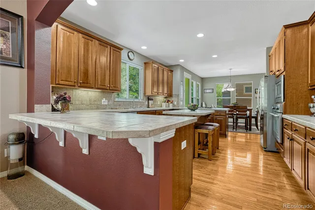 a kitchen with stainless steel appliances granite countertop a stove and a sink