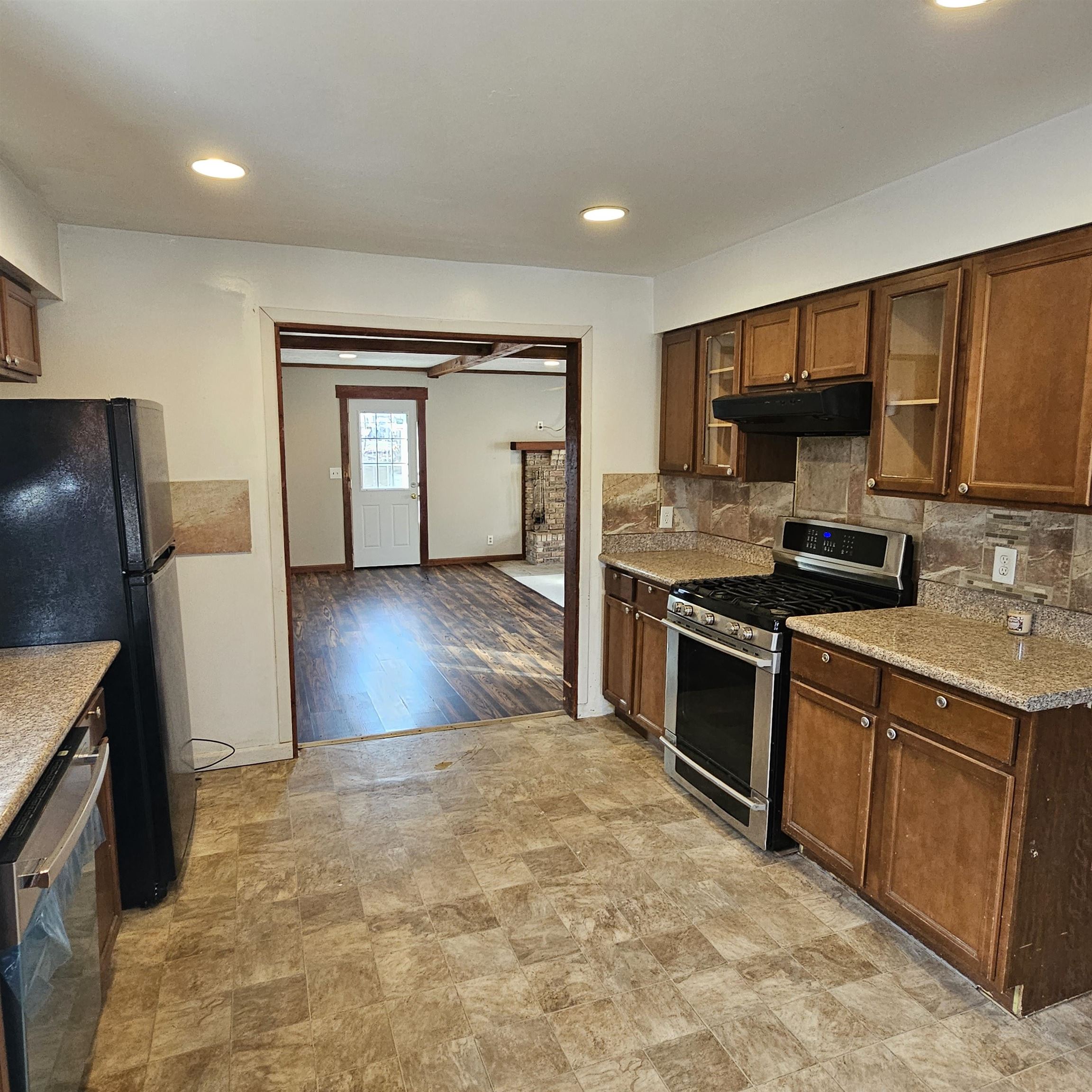 1925 Remington Road Rockford, IL 61108 - Photo 4 of 14 a kitchen with stainless steel appliances granite countertop a stove a sink and a refrigerator