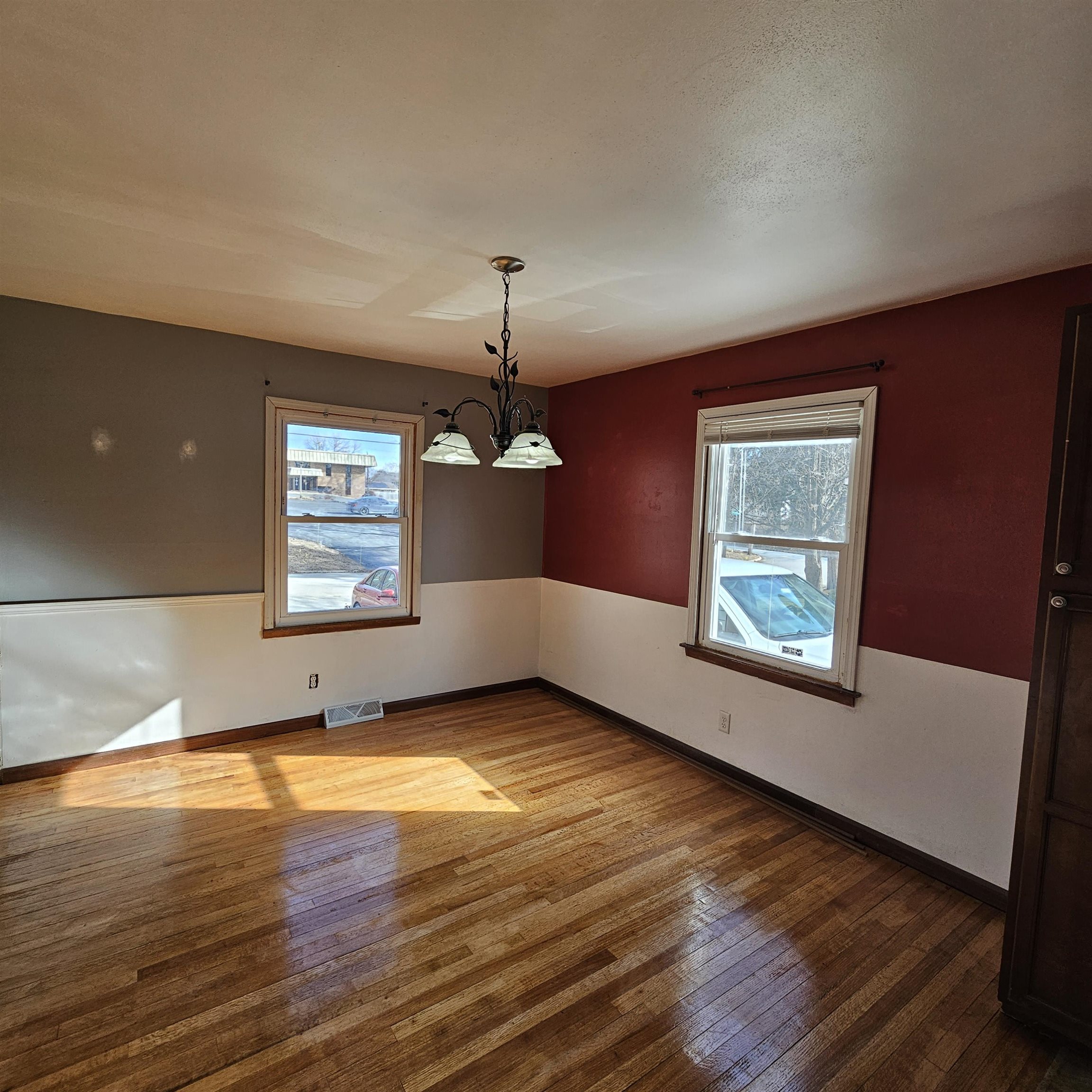 1925 Remington Road Rockford, IL 61108 - Photo 6 of 14 a view of an empty room with window and wooden floor