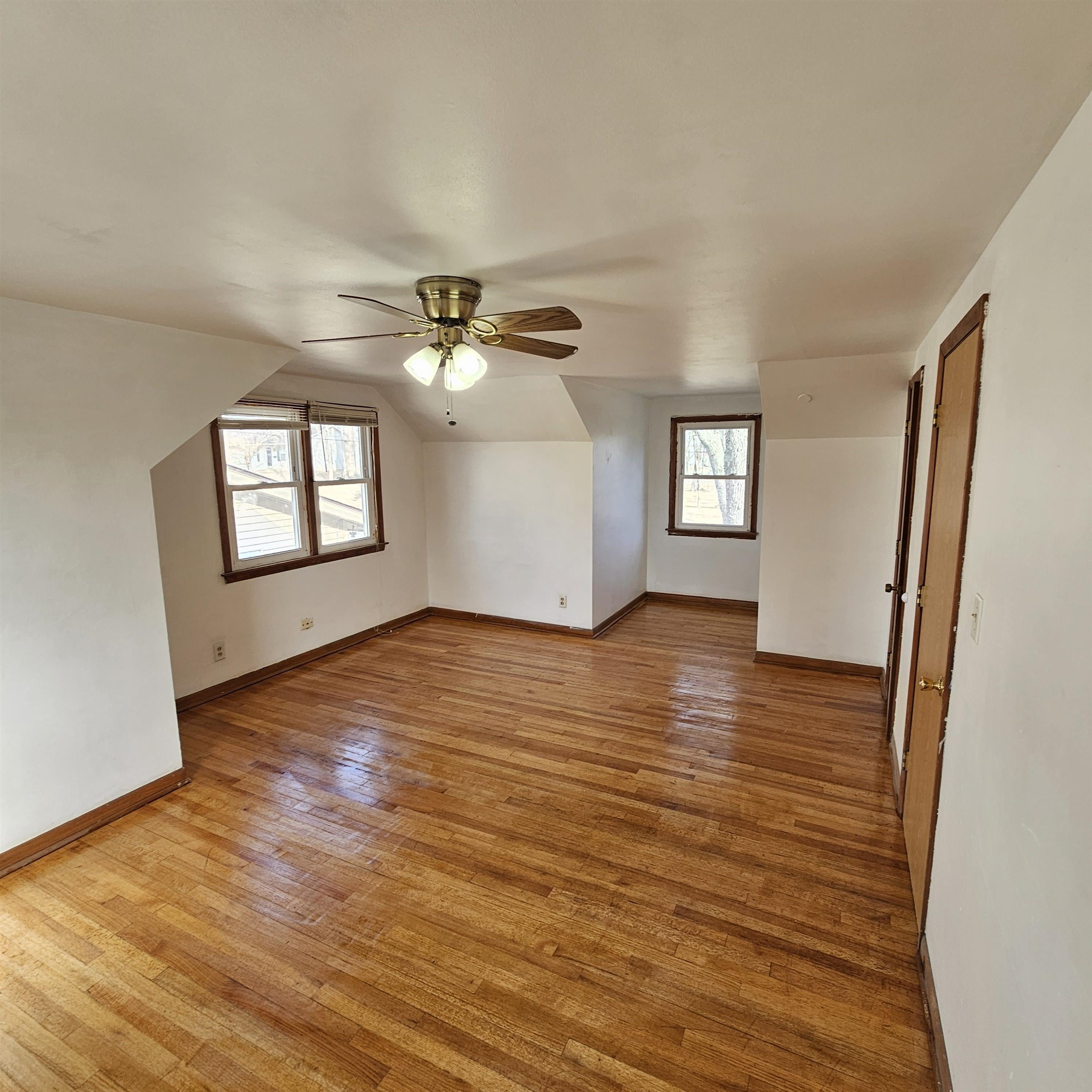 1925 Remington Road Rockford, IL 61108 - Photo 9 of 14 an empty room with wooden floor and windows