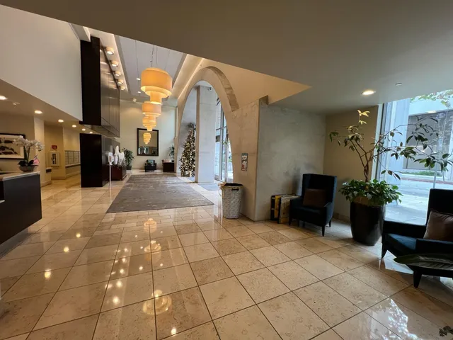 a living room with lots of furniture and white walls