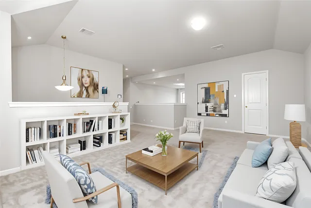 a living room with furniture and a table