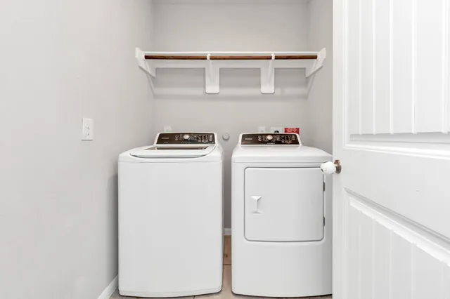 a utility room with dryer and washer