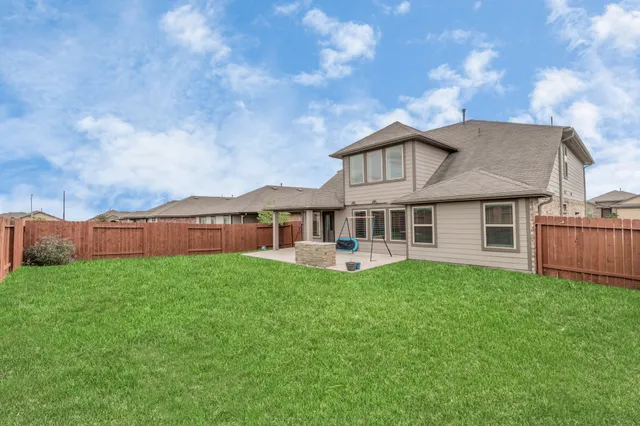 a front view of a house with yard and porch
