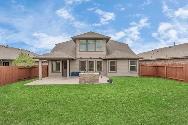 a front view of a house with a yard and porch