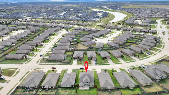 an aerial view of residential houses with outdoor space