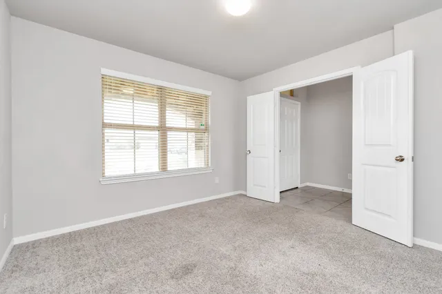 an empty room with windows