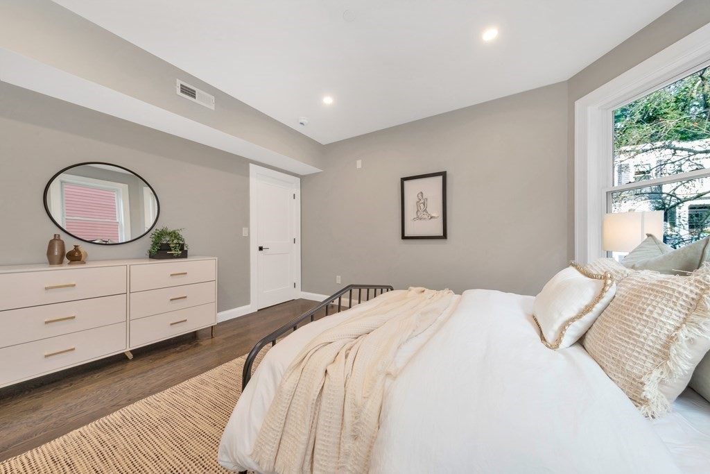 87 Parkton Road, Unit 3 Boston, MA 02130 - Photo 14 of 38 a bedroom with a bed and a dresser