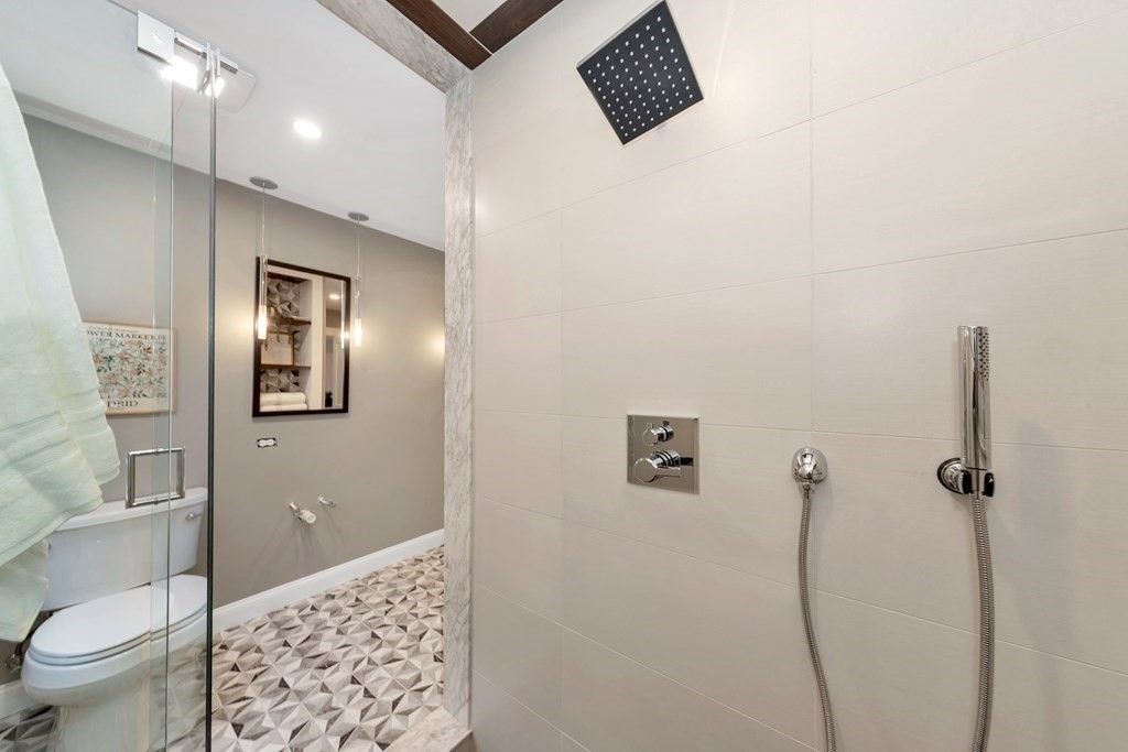 87 Parkton Road, Unit 3 Boston, MA 02130 - Photo 16 of 38 a bathroom with a toilet sink and shower