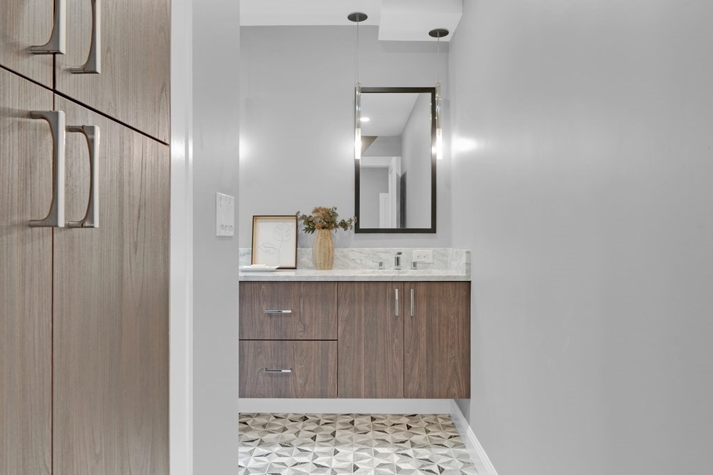 87 Parkton Road, Unit 3 Boston, MA 02130 - Photo 19 of 38 a bathroom with a sink and a mirror