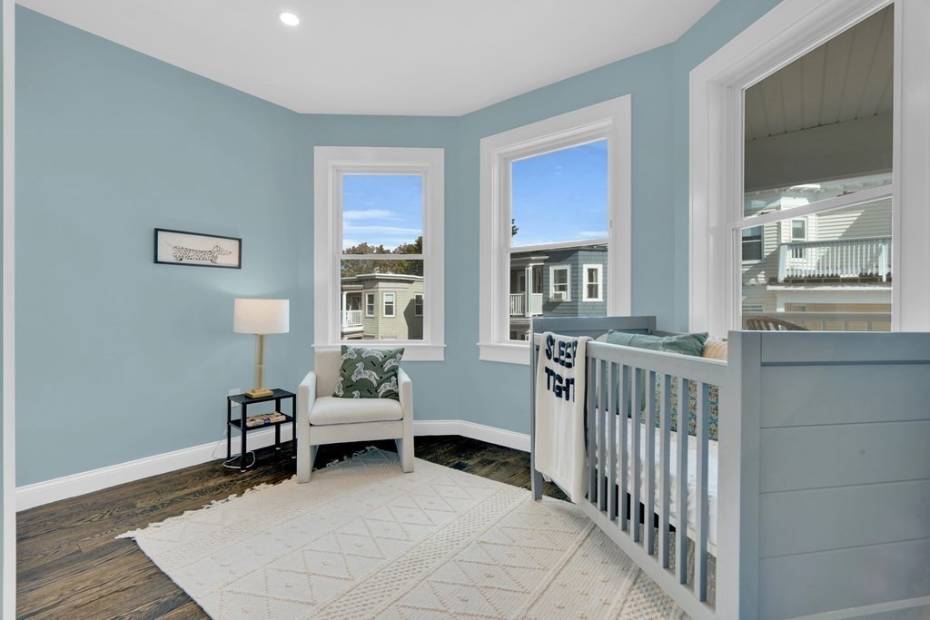 87 Parkton Road, Unit 3 Boston, MA 02130 - Photo 24 of 38 a bedroom with furniture and a window