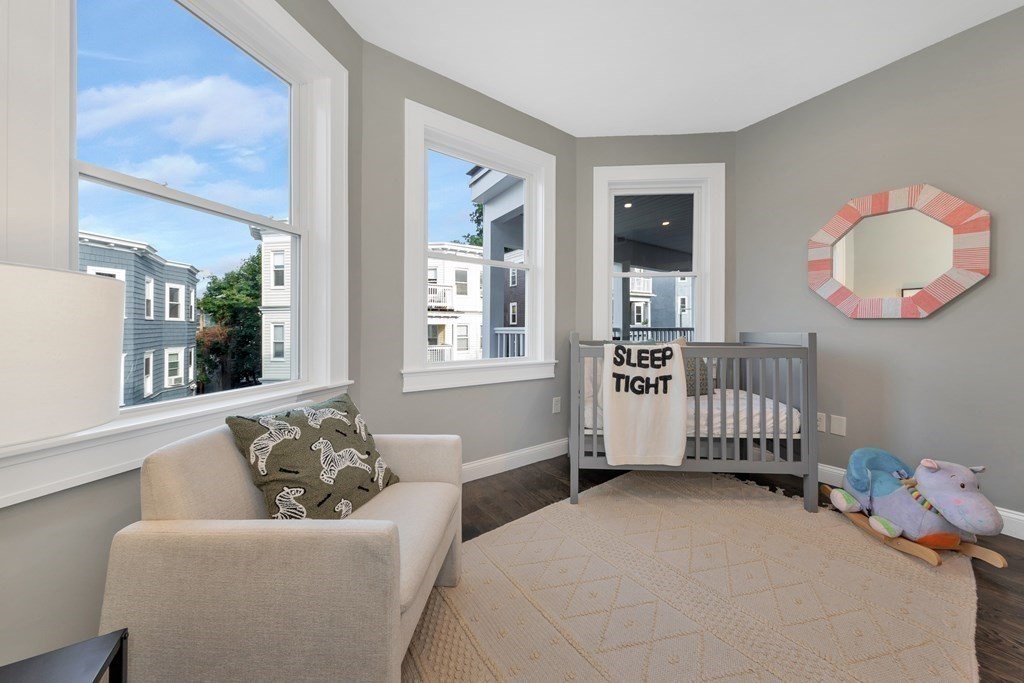 87 Parkton Road, Unit 3 Boston, MA 02130 - Photo 25 of 38 a bedroom with furniture and a window