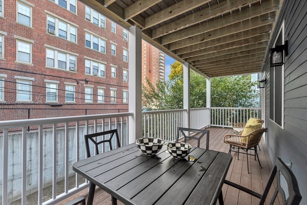 87 Parkton Road, Unit 3 Boston, MA 02130 - Photo 30 of 38 a view of a balcony with chairs