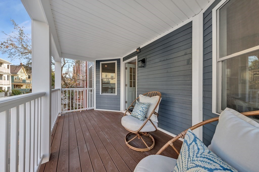 87 Parkton Road, Unit 3 Boston, MA 02130 - Photo 31 of 38 a view of a balcony with chair and wooden floor