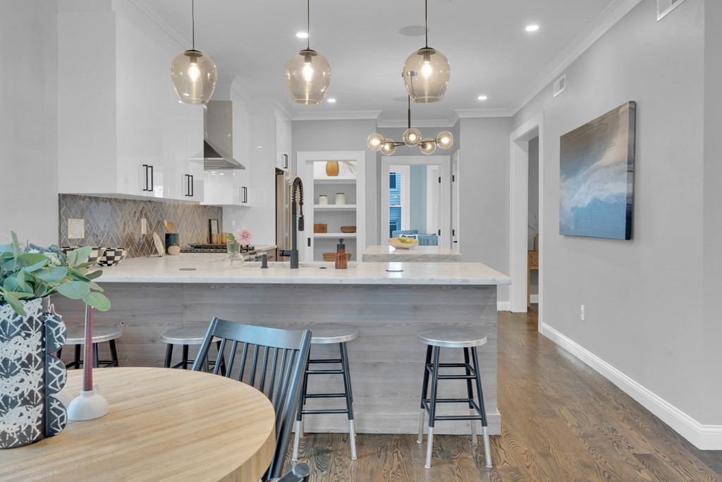 87 Parkton Road, Unit 3 Boston, MA 02130 - Photo 7 of 38 a kitchen with sink table and chairs